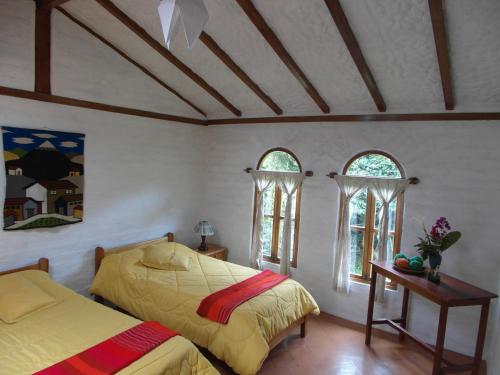 Un pat sau paturi într-o cameră la Hospedaje Higueron
