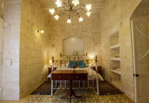 a bathroom with a mirror and a table in a room at Town house steeped in history in Rabat