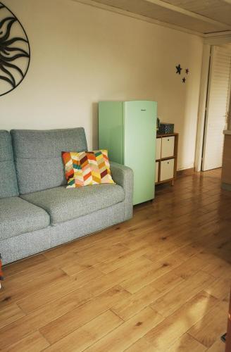a living room with a couch and a refrigerator at Cara Catherine in Geremèas