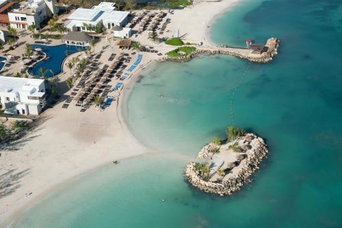 an aerial view of a beach with a resort at Royalton Hideaway Blue Waters, An Autograph Collection All-Inclusive Resort - Adults Only in Falmouth