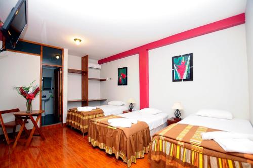 Ένα ή περισσότερα κρεβάτια σε δωμάτιο στο Hotel Puerto Amazonico