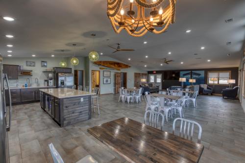 a large kitchen and dining room with tables and chairs at Lewis & Clark Resort in Yankton