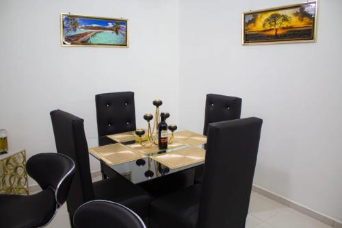 a dining room with a table and chairs at Caribbean Apartment in La Romana