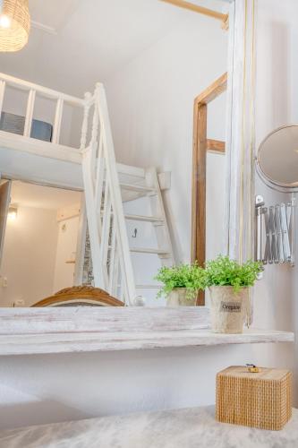 a room with a bunk bed and a mirror at Mascot Boutique Hotel in Rhodes Town