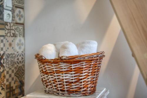 a basket of towels sitting on a shelf at Mascot Boutique Hotel in Rhodes Town