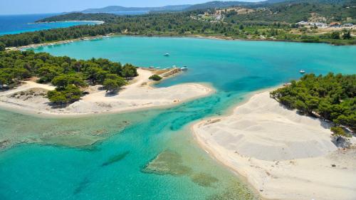 an aerial view of a group of islands in the water at Akrogiali Exclusive Hotel (Adults Only) in Polykhrono