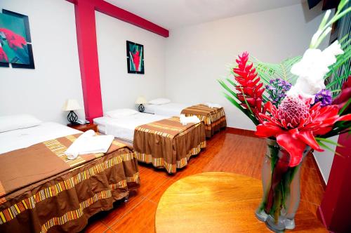 Ένα ή περισσότερα κρεβάτια σε δωμάτιο στο Hotel Puerto Amazonico