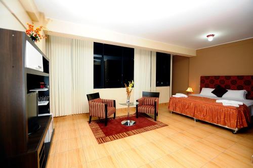 Ένα ή περισσότερα κρεβάτια σε δωμάτιο στο Hotel Puerto Amazonico