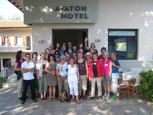 a group of people posing for a picture in front of a hotel at Avaton Hotel in Ligourio