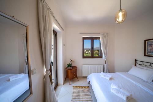 Voodi või voodid majutusasutuse FOS residence - ΦΩΣ ,luxury villa toas
