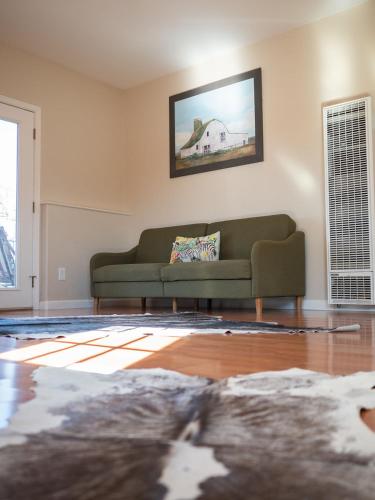 a living room with a couch and a rug at Z Ranch in Templeton