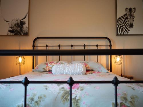 a bedroom with a bed with two lamps on it at Z Ranch in Templeton