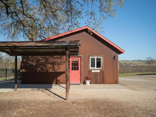 a smallshed with a red door and a red door at Z Ranch in Templeton