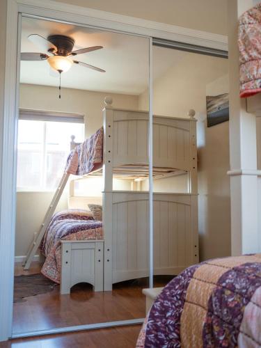 a bedroom with a bunk bed and a mirror at Z Ranch in Templeton