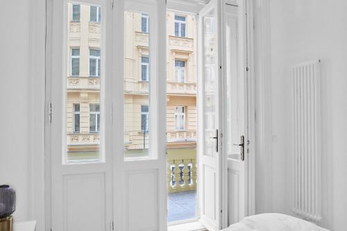 a room with a white door and a window at Residence Dlouha - Old Town in Prague