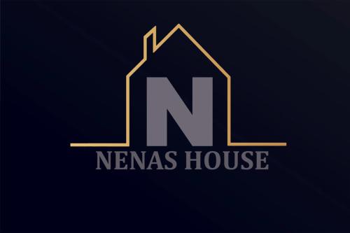 a letter n and a house logo in gold at Nenas House in Iraklitsa