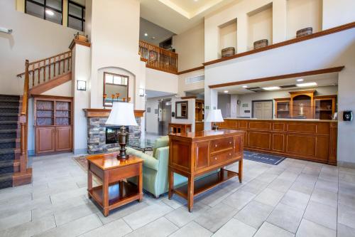 a living room with a desk and a couch at Country Inn & Suites by Radisson, Tucson City Center AZ in Tucson