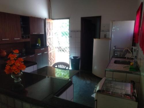 a kitchen with a sink and a counter top at Casa para Temporada as Marges do Rio Sao Francisco - PIRANHAS-ALAGOAS in Canindé de São Francisco