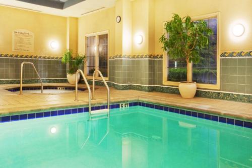 a large swimming pool in a hotel room at Sonesta Atlanta Airport South in Atlanta