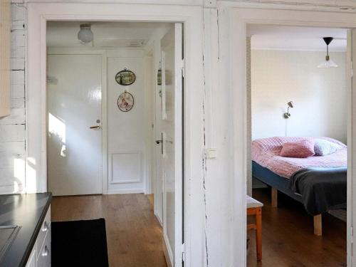 a kitchen with a bedroom with a bed in it at 5 person holiday home in Fjärås-By Traum in Fjärås