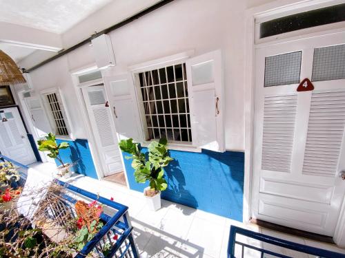 a house with a swimming pool next to a door at Suri's House Homestay in Da Lat