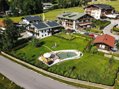 an aerial view of a house with a swimming pool at Apart Chalet Unterbrandnerlehen in Schönau am Königssee