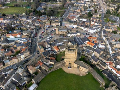 an aerial view of a city with a tower at Comfy Dales holiday base on Market Place of historic market town in Richmond