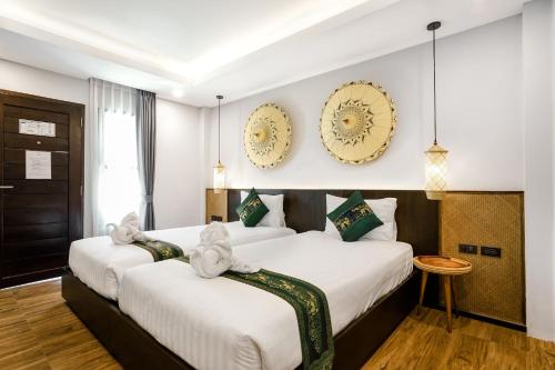 Katil atau katil-katil dalam bilik di Paraiso Hotel Chiangmai