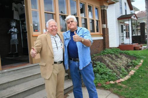 two older men standing in front of a house at The Avanti Houses in South Bend