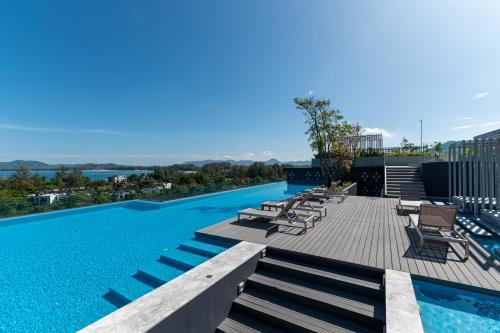 a swimming pool on top of a building at Aristo 2 Phuket by RESAVA in Surin Beach