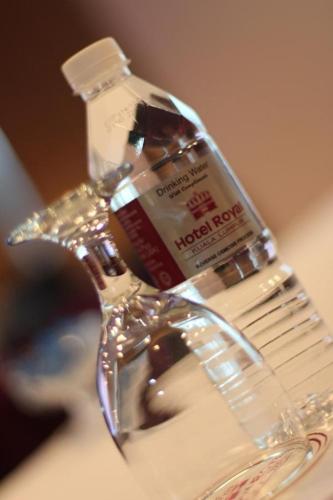 a bottle of toothpaste sitting on top of a sink at Hotel Royal Kuala Lumpur in Kuala Lumpur