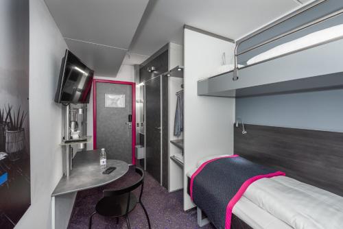 Postel nebo postele na pokoji v ubytování Cabinn Copenhagen