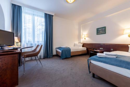 Postel nebo postele na pokoji v ubytování Trip Inn Klee am Park Wiesbaden