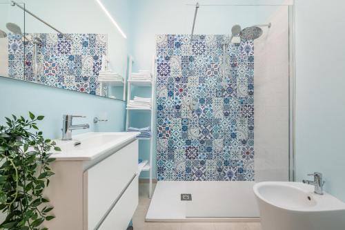 a bathroom with a shower and a sink at La casa dei naviganti in Villasimius
