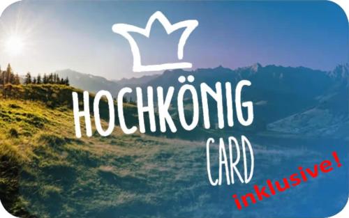 a sign that says hhodenburg card inclusive of a mountain at Alpin Apartments in Maria Alm am Steinernen Meer