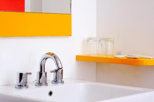 a kitchen sink with a sink at Amaris Hotel Pakuan Bogor in Bogor