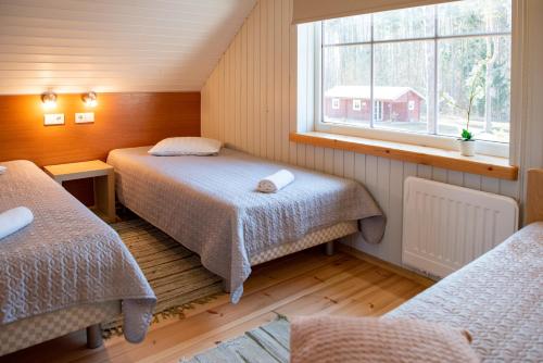 Voodi või voodid majutusasutuse Tehumardi Camping toas