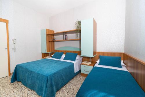 Postel nebo postele na pokoji v ubytování Hotel Sampaoli