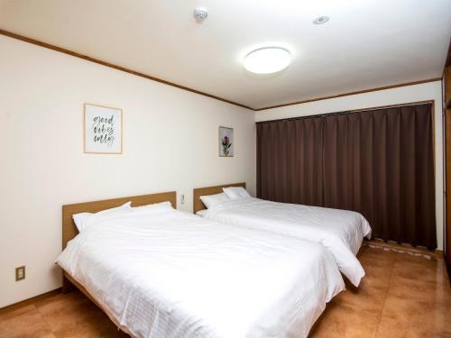 Postel nebo postele na pokoji v ubytování K's Hotel