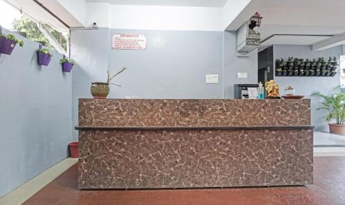 a counter in a room with a counter top at Treebo Trend Diamond Residency - DDPK Inn in Pune