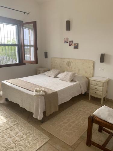 A bed or beds in a room at Casa Nerelie'S