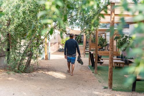 a man walking down a path in a park at Ras Hasita in H̱aẕeva