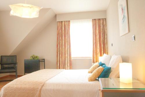 Postel nebo postele na pokoji v ubytování B&B Goudsbloempje