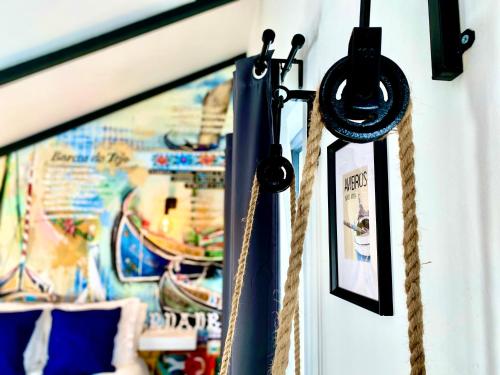 a pair of ropes hanging on a wall with a map at Villa Rio by Valada Village in Valada