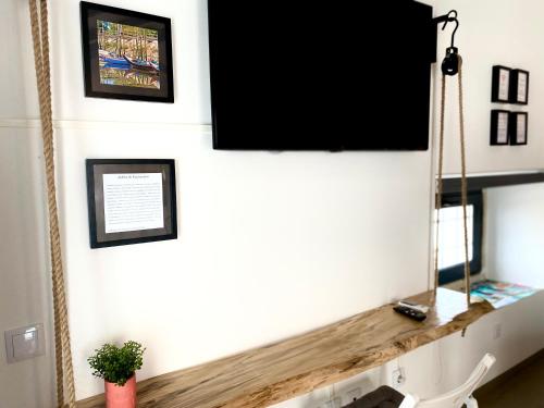 a living room with a tv on a white wall at Villa Rio by Valada Village in Valada
