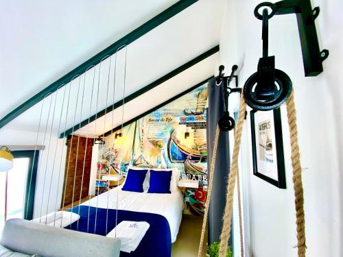a room with a bed and a rope swing at Villa Rio by Valada Village in Valada