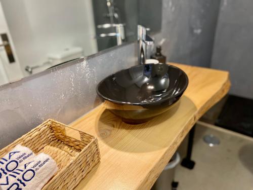 a black sink sitting on top of a wooden counter at Villa Rio by Valada Village in Valada