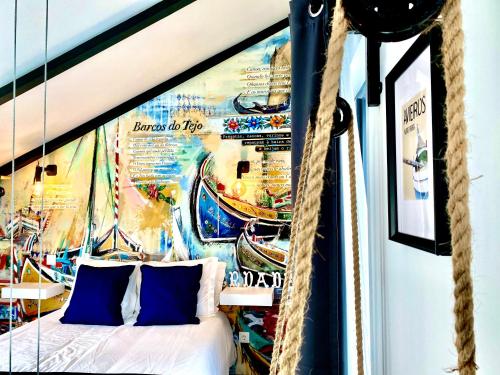 a bedroom with a poster on the wall of a boat at Villa Rio by Valada Village in Valada