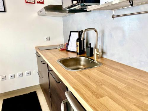 a kitchen with a sink and a counter top at Villa Rio by Valada Village in Valada