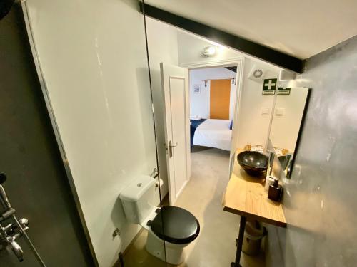 a small bathroom with a toilet and a mirror at Villa Rio by Valada Village in Valada